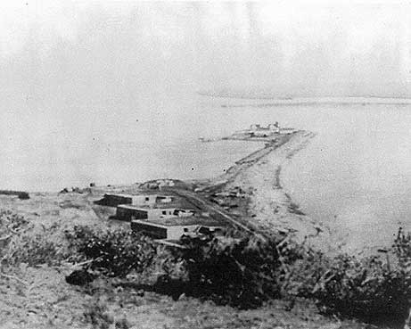 Figure 7.7 Battery Wilkeson. This view depicts Battery Wilkeson and Fetterman overlooking the 1890 lighthouse and whaler’s warehouses at the eastern tip of Ballast Point. The ruins of Fort Guijarros would be to the right of the largest gun battery, Battery Wilkeson. Source: Architect Milford Wayne Donaldson, FAIA, Inc. 